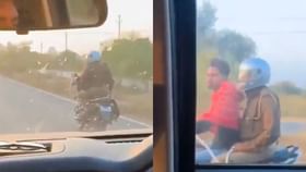 Viral Video : கை விலங்குடன் பைக் ஓட்டிய கைதி.. ஜாலியாக பின்னால் அமர்ந்து சென்ற போலீஸ்.. வைரல் வீடியோ!